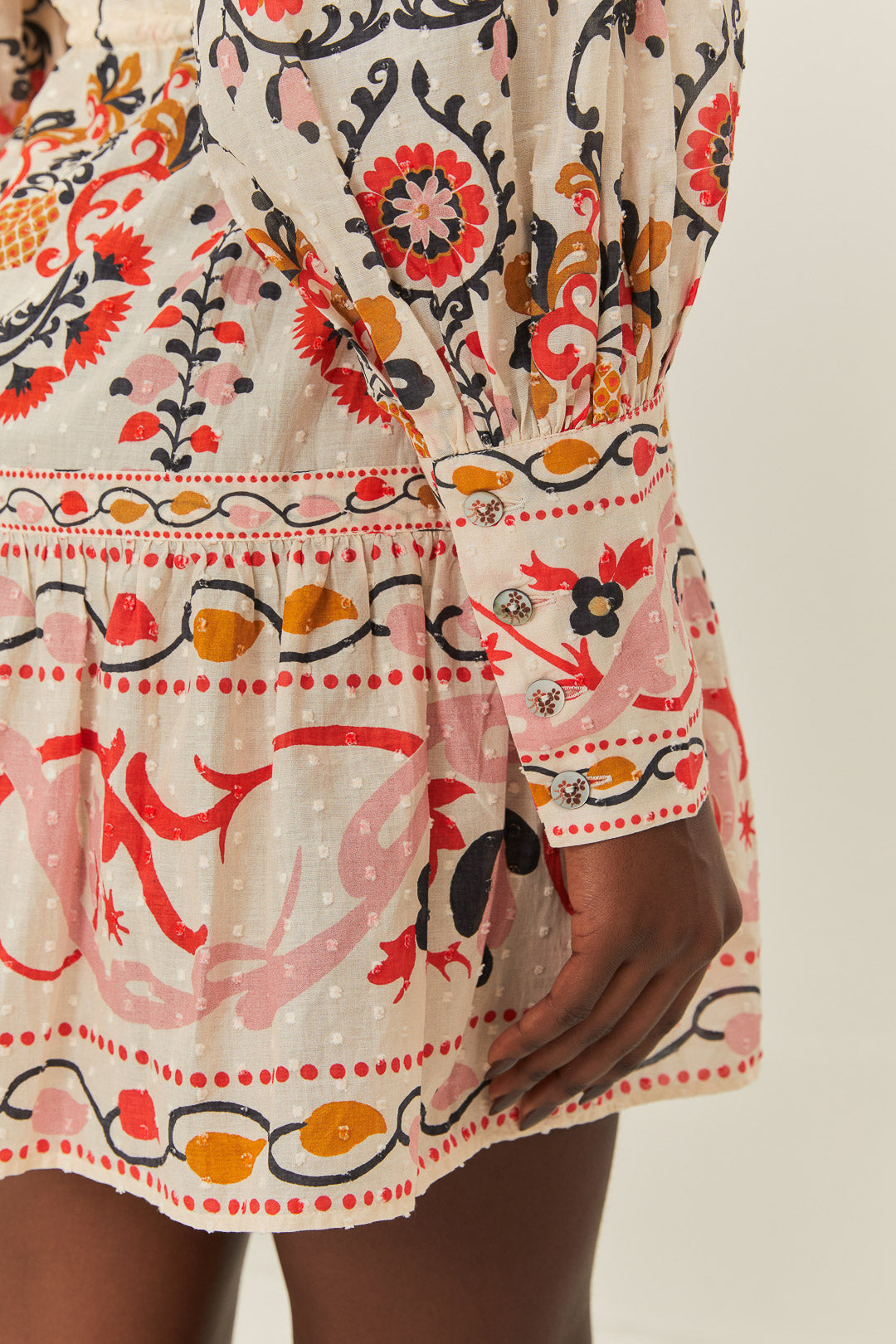 FARM Rio model wearing the Cashew Mandala Cream Mini Dress