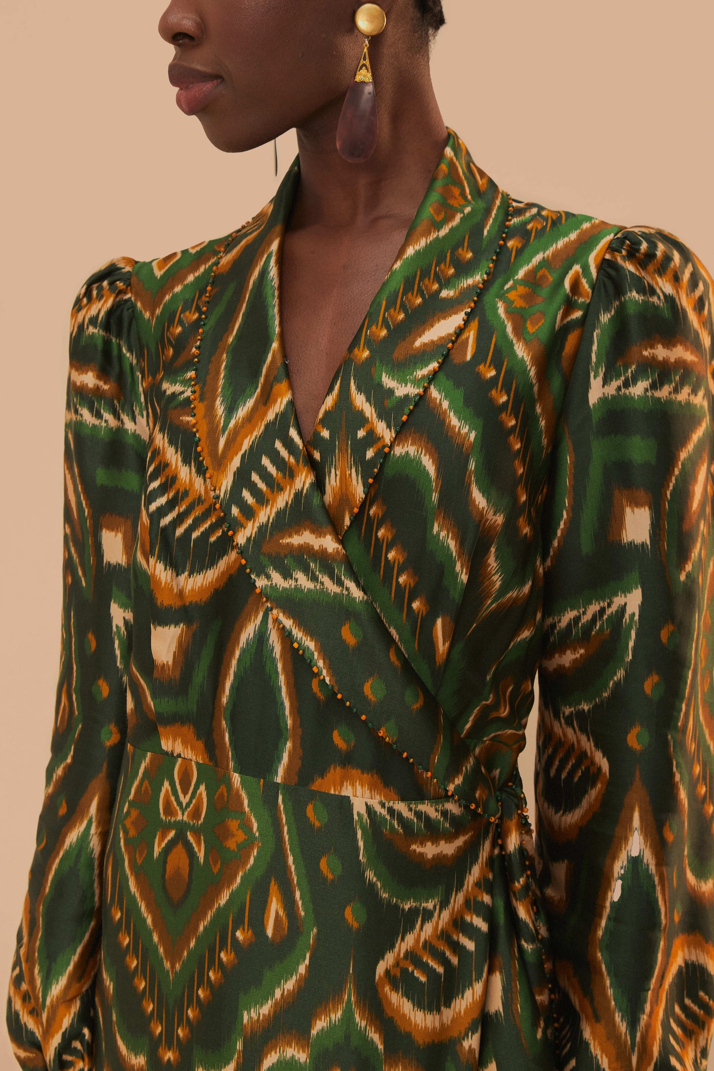 FARM Rio model wearing the Pineapple Ikat Green Long Sleeve Midi Dress