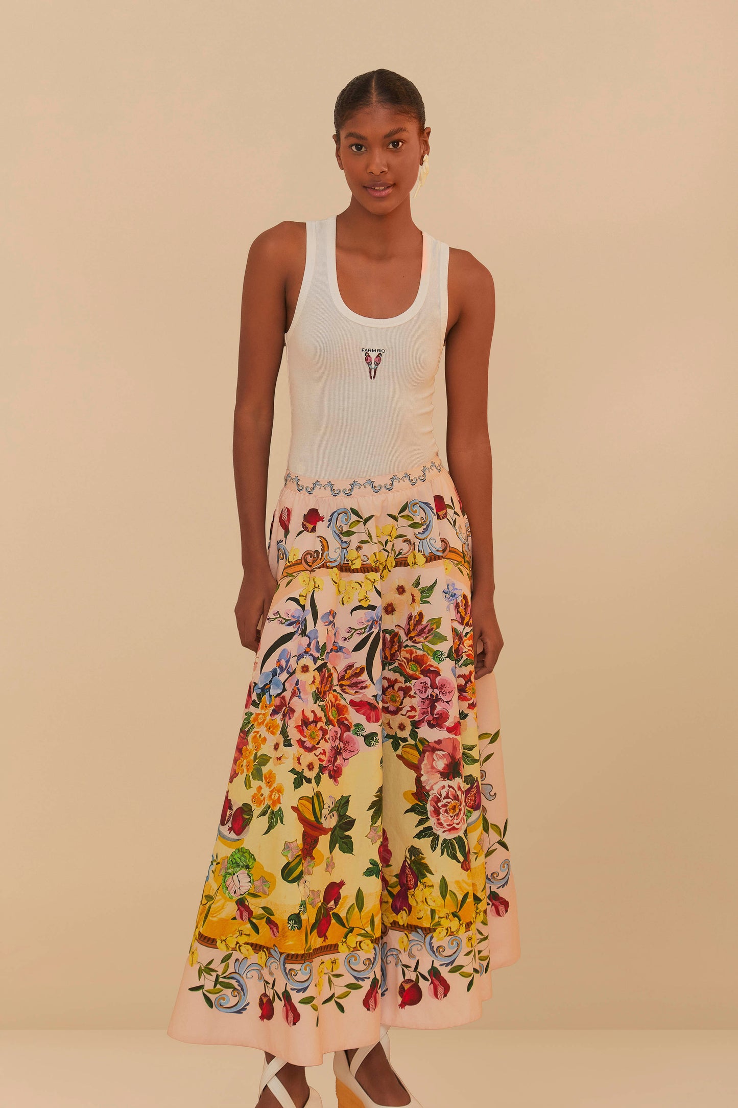 FARM Rio model wearing the Pink Garden Terrace Organic Cotton Midi Skirt