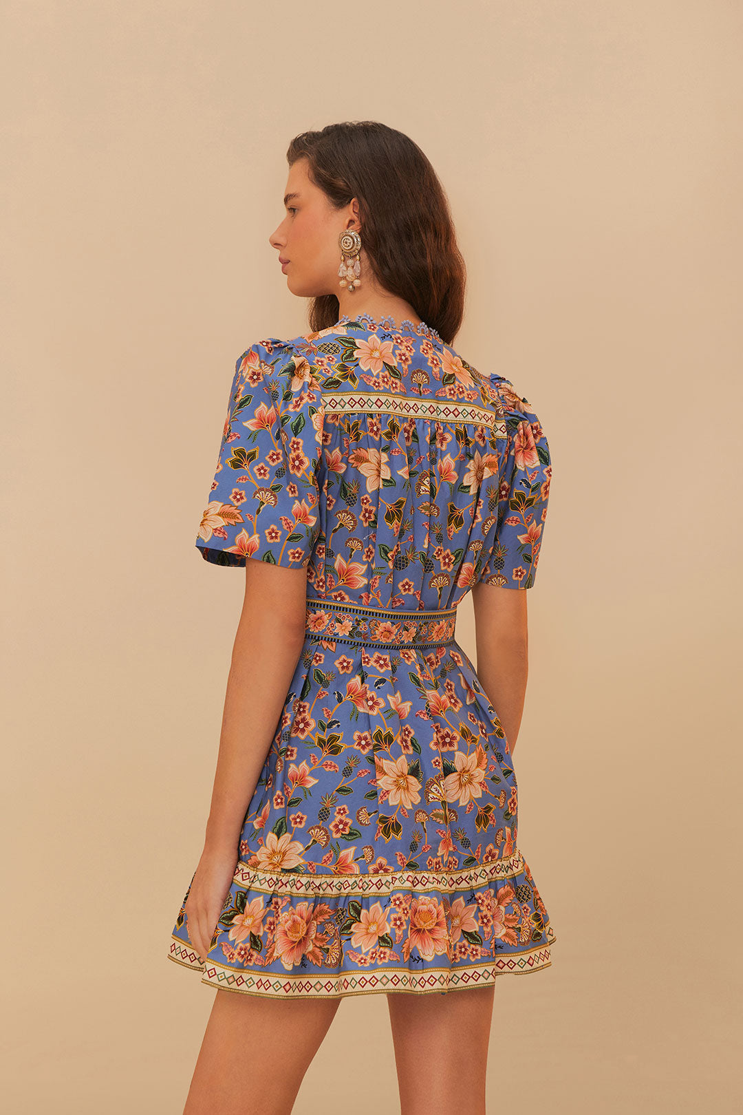 FARM Rio model wearing the Blue Superbloom Tapestry Organic Cotton Mini Dress