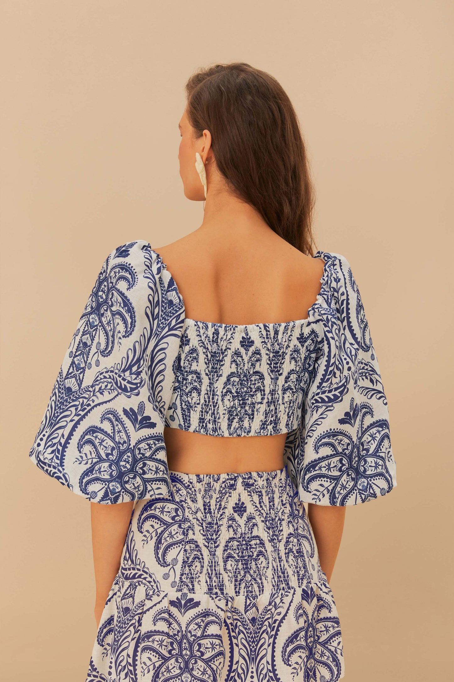 FARM Rio model wearing the Blue Tropical Cameo Off-White Blouse
