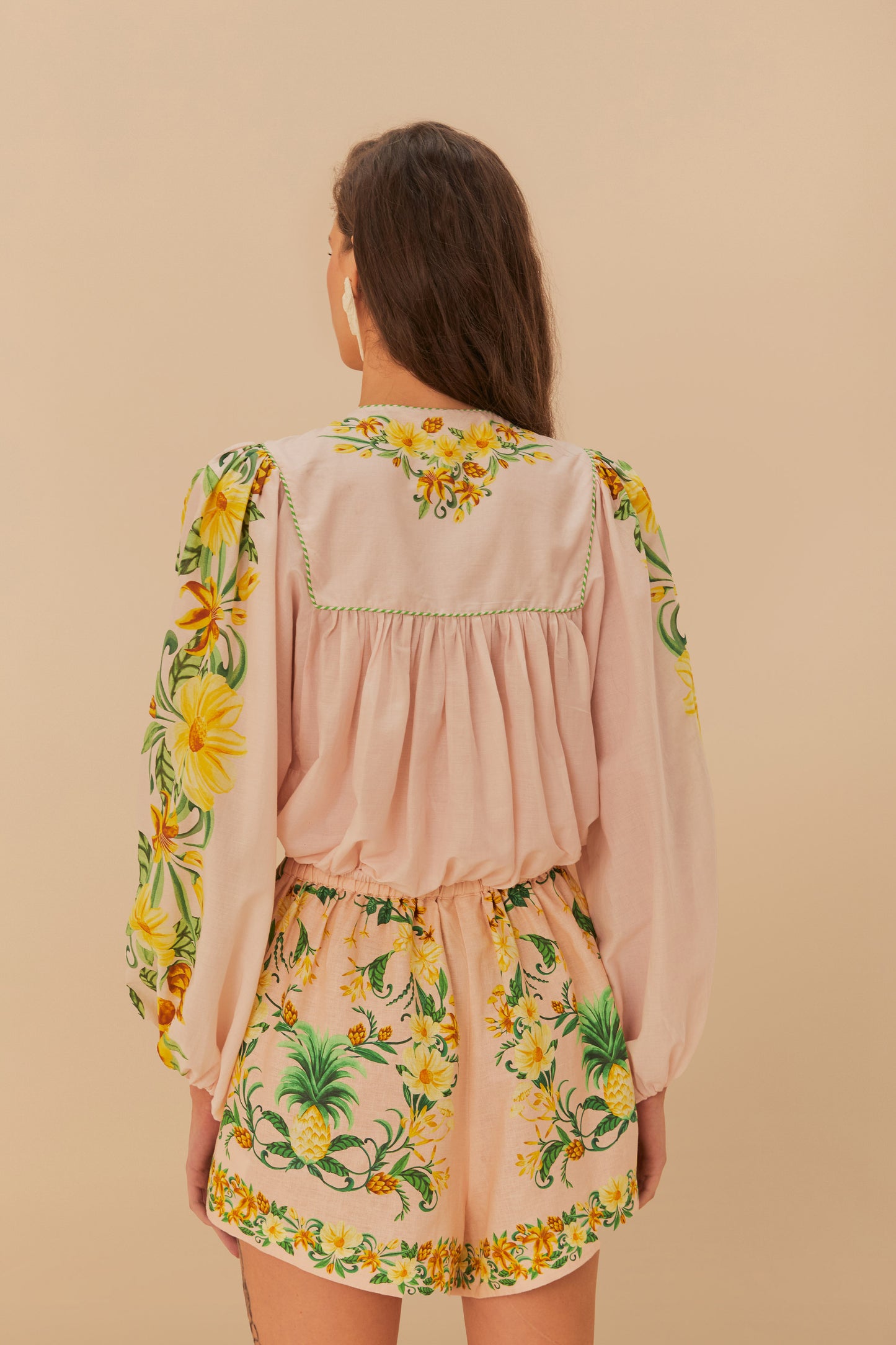 FARM Rio model wearing the Pink Botanical Beauty Long Sleeve Blouse
