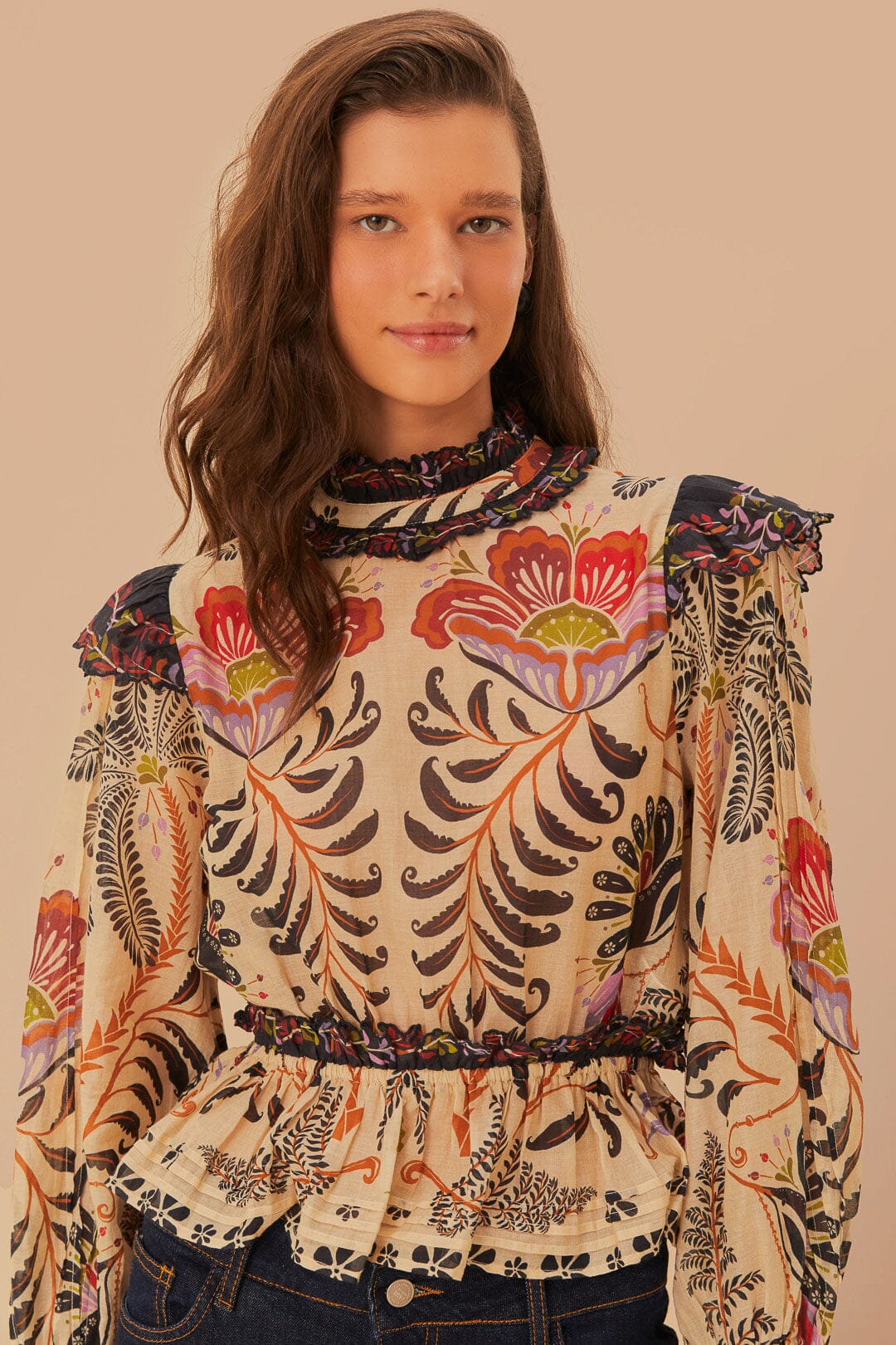 FARM Rio model wearing the Classic Nature Sand Ruffled Long Sleeve Blouse