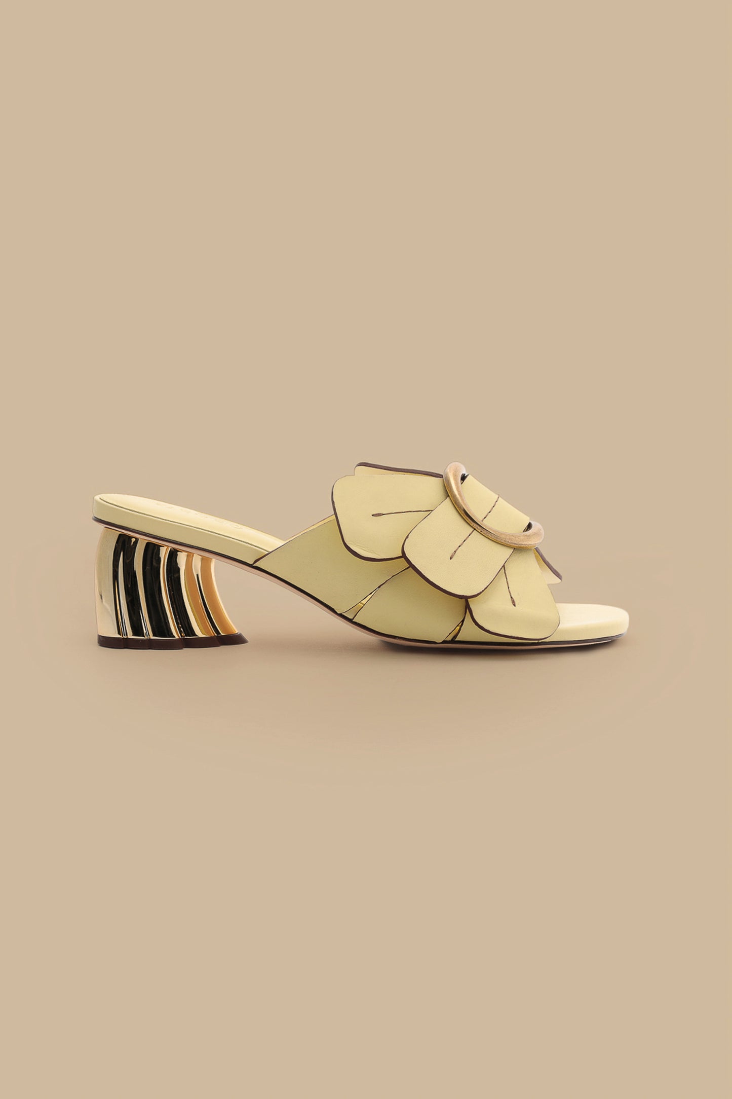 FARM Rio model wearing the Banana Yellow Daisy Heeled Mule