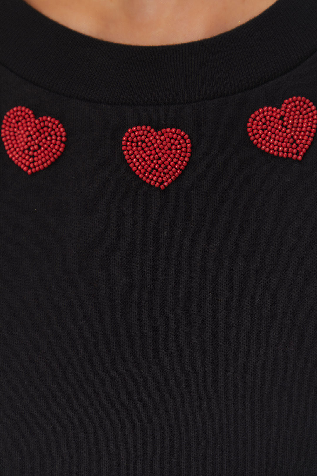 FARM Rio model wearing the Black Beaded Hearts T-Shirt