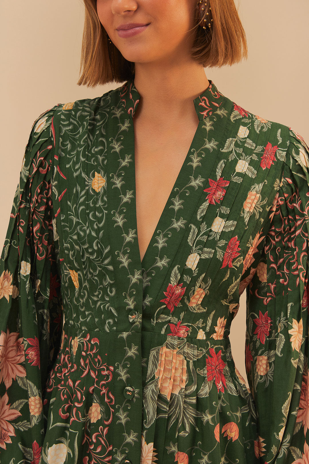FARM Rio model wearing the Green Pineapple Garden Long Sleeve Mini Dress