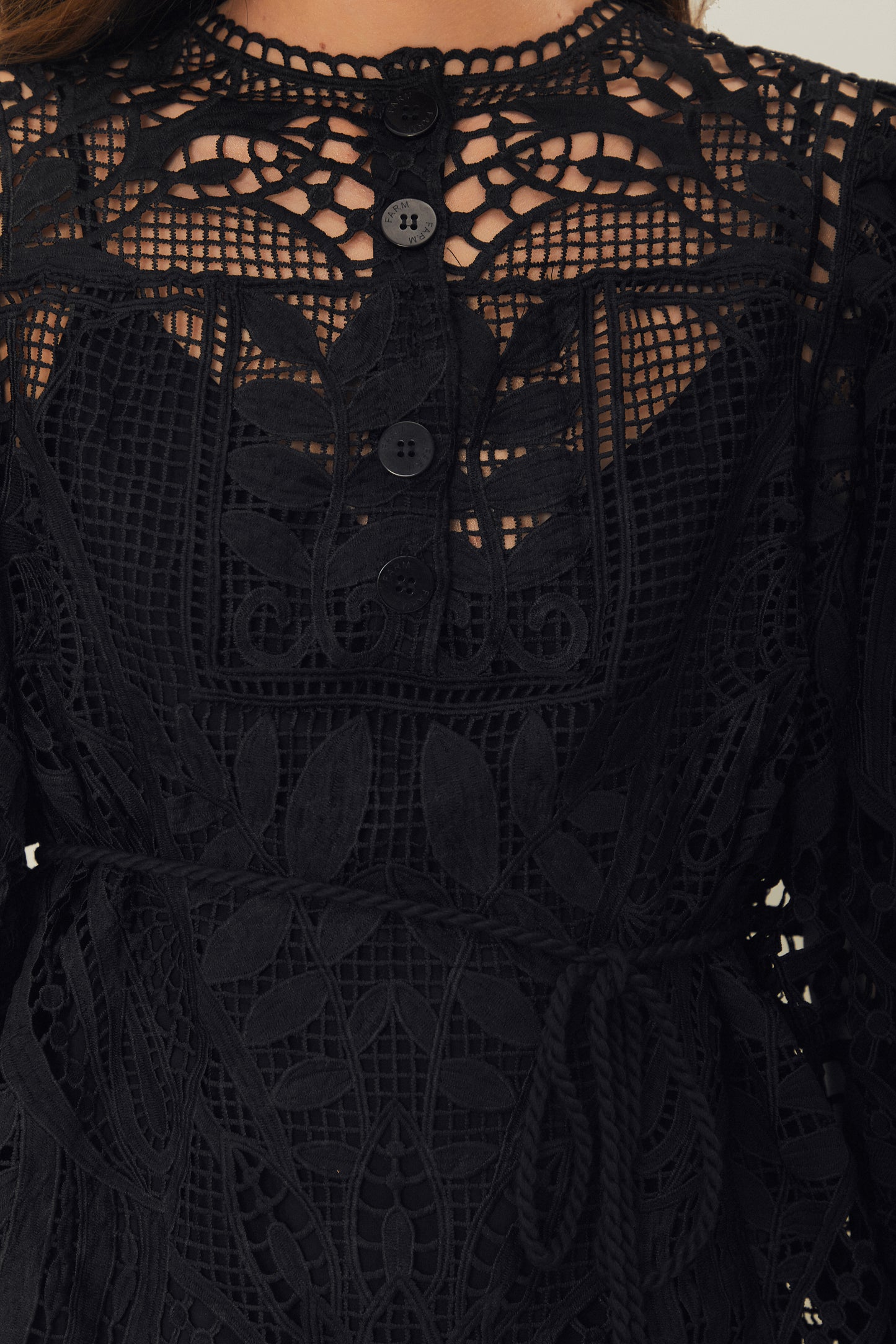 FARM Rio model wearing the Black Guipire Puff Sleeve Blouse