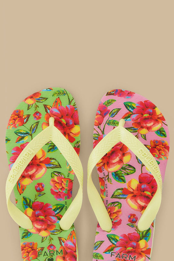 FARM Rio model wearing the Neon Flowers Havaianas