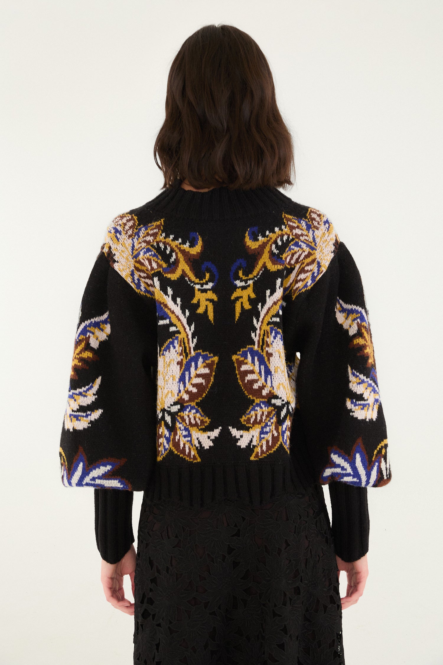 FARM Rio model wearing the Arabesque Paradise Knit Sweater