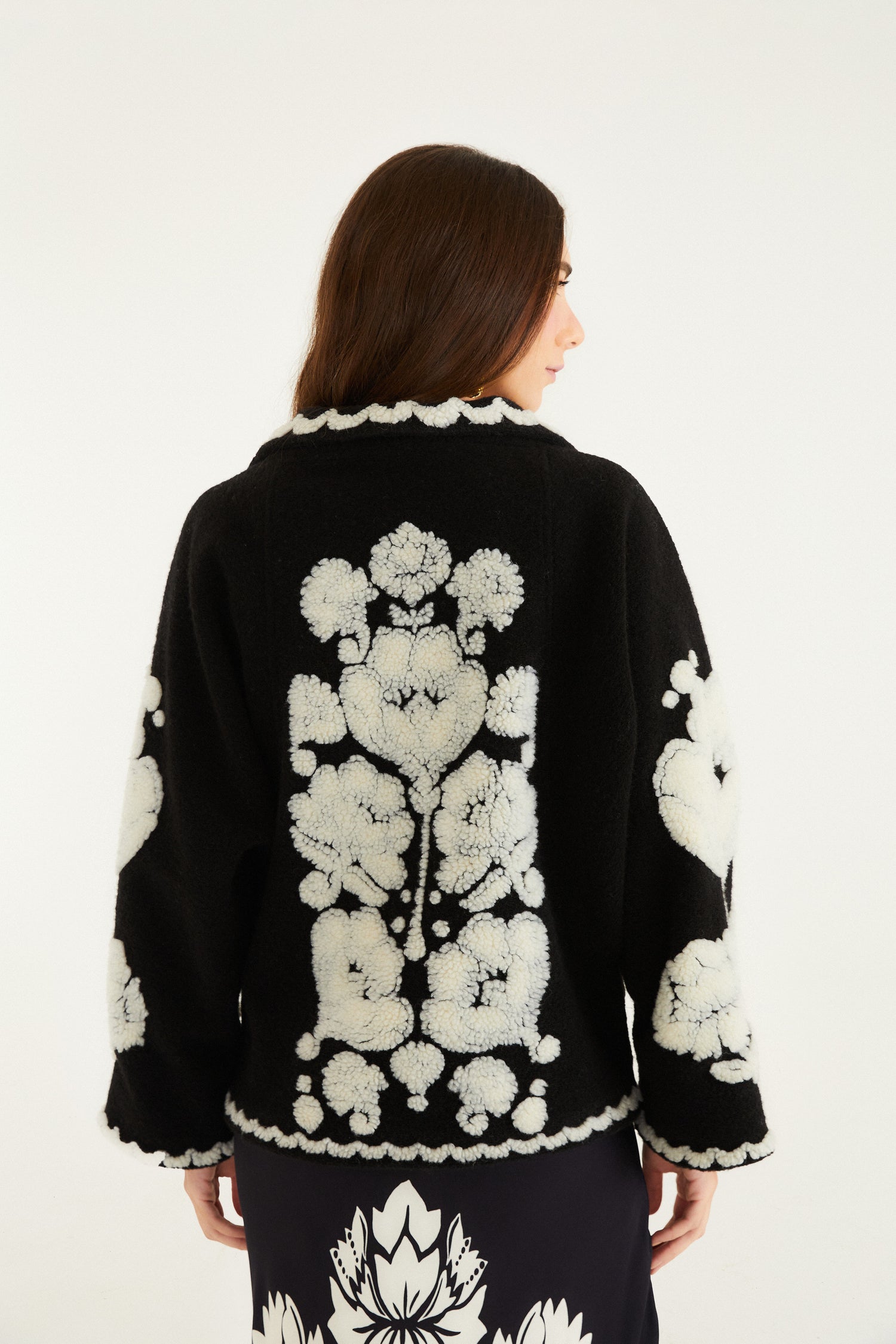 FARM Rio model wearing the Black & White Floral Arabesque Fleece Coat