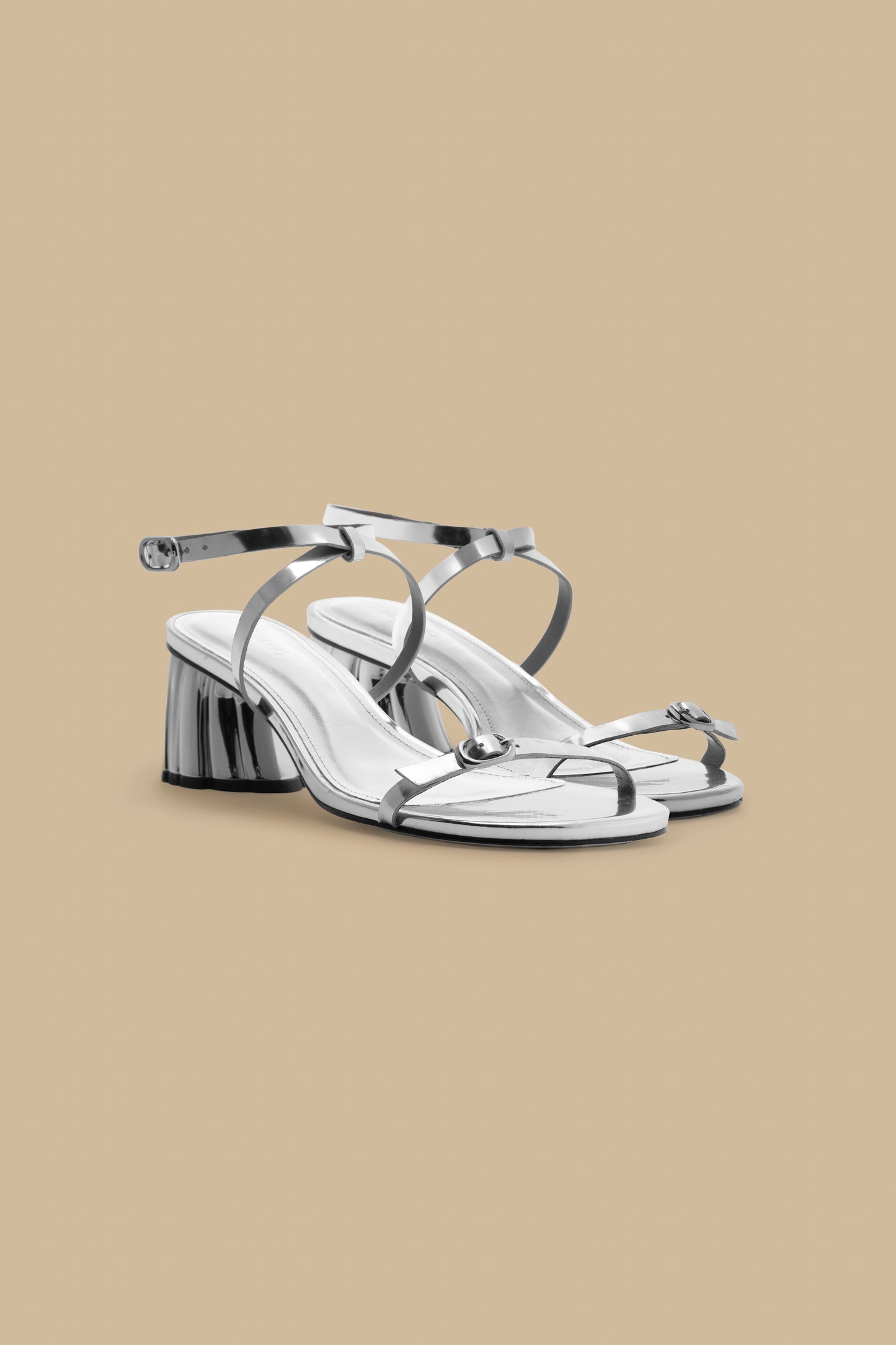 FARM Rio model wearing the Silver Monstera Heeled Scallop Sandal