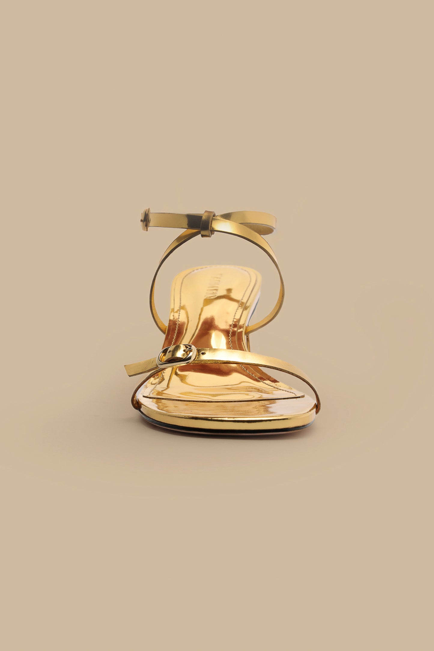 FARM Rio model wearing the Gold Monstera Heel Scalop Sandal