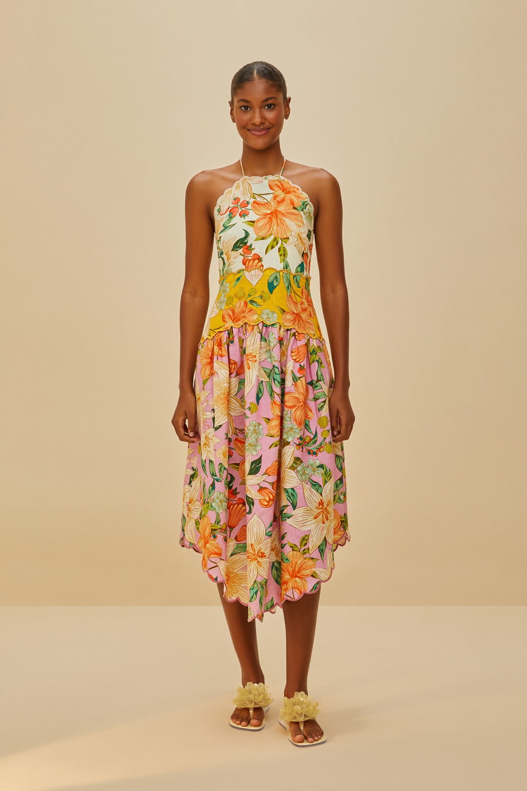 FARM Rio model wearing the Buttermilk Flower Jelly Flat Sandal