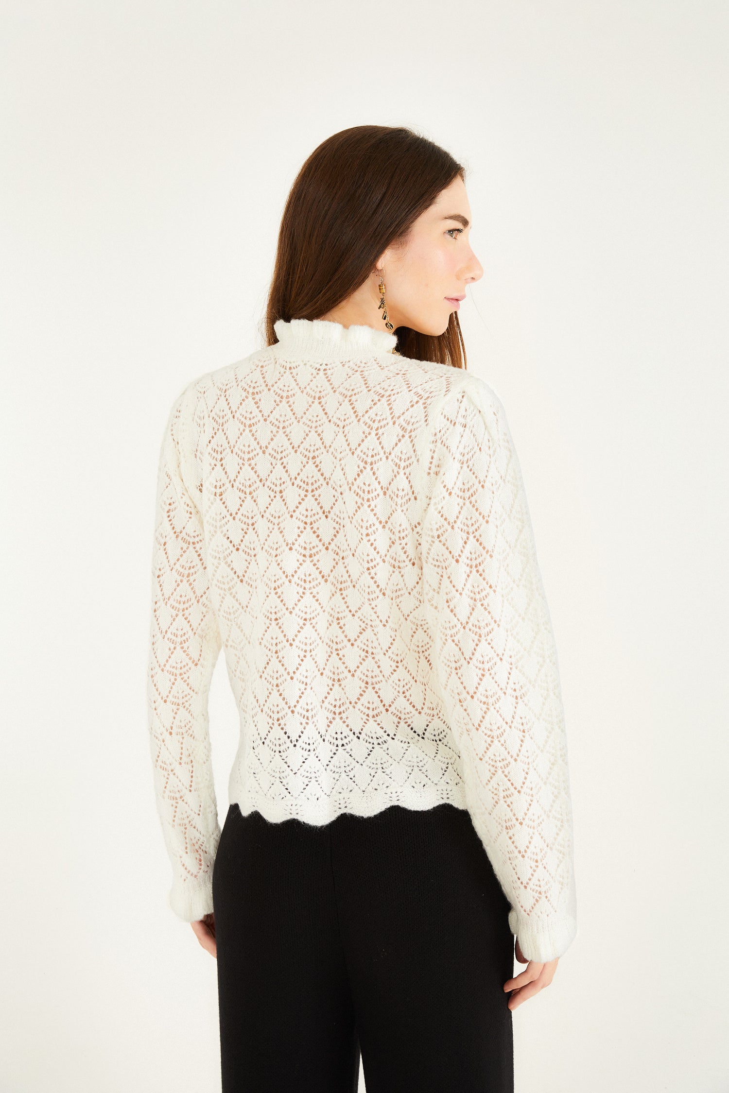 FARM Rio model wearing the Lace Stitch Ruffles Off-White Knit Blouse