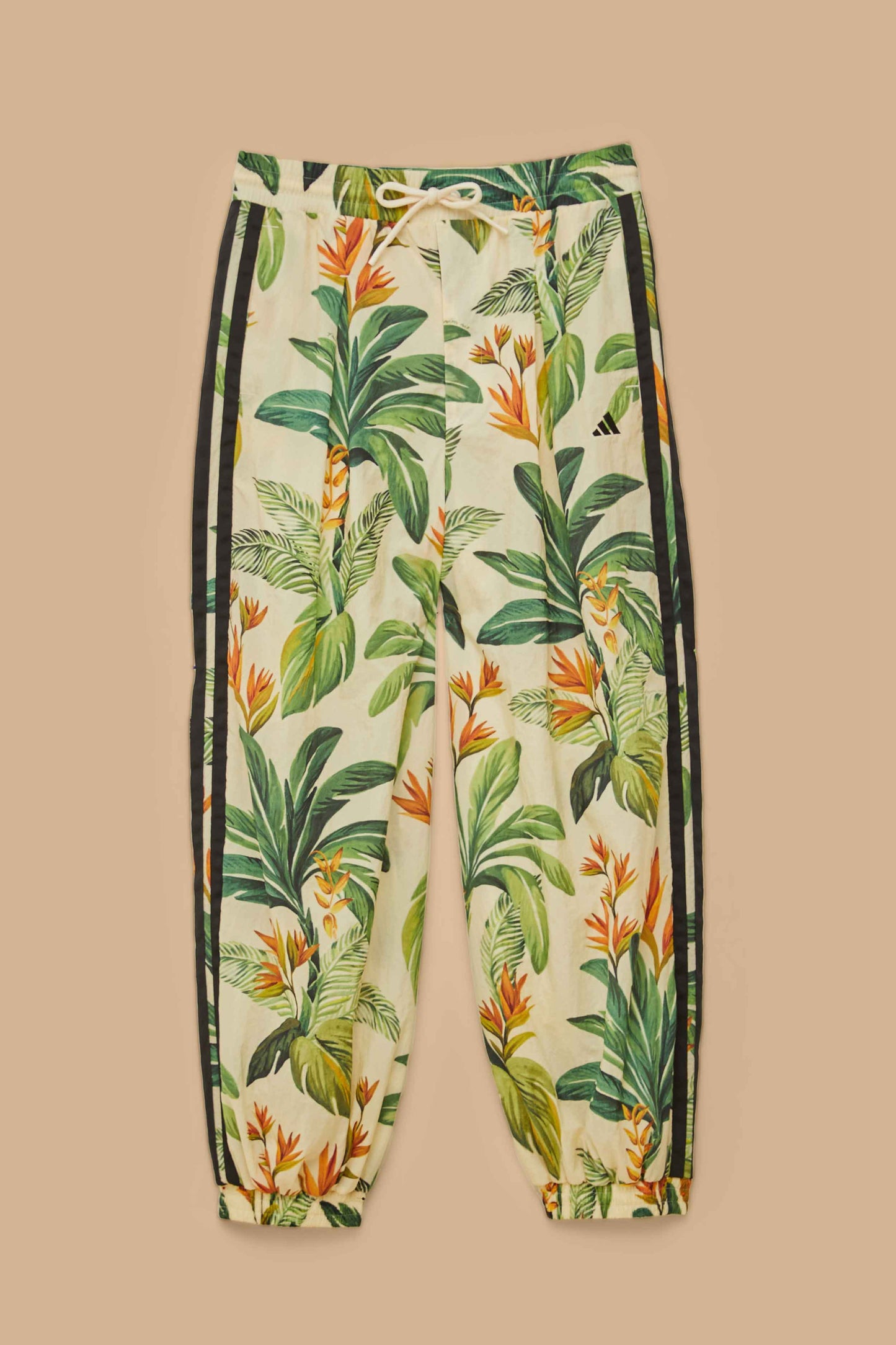 FARM Rio model wearing the Adidas Tropical Breeze Cream White Pants