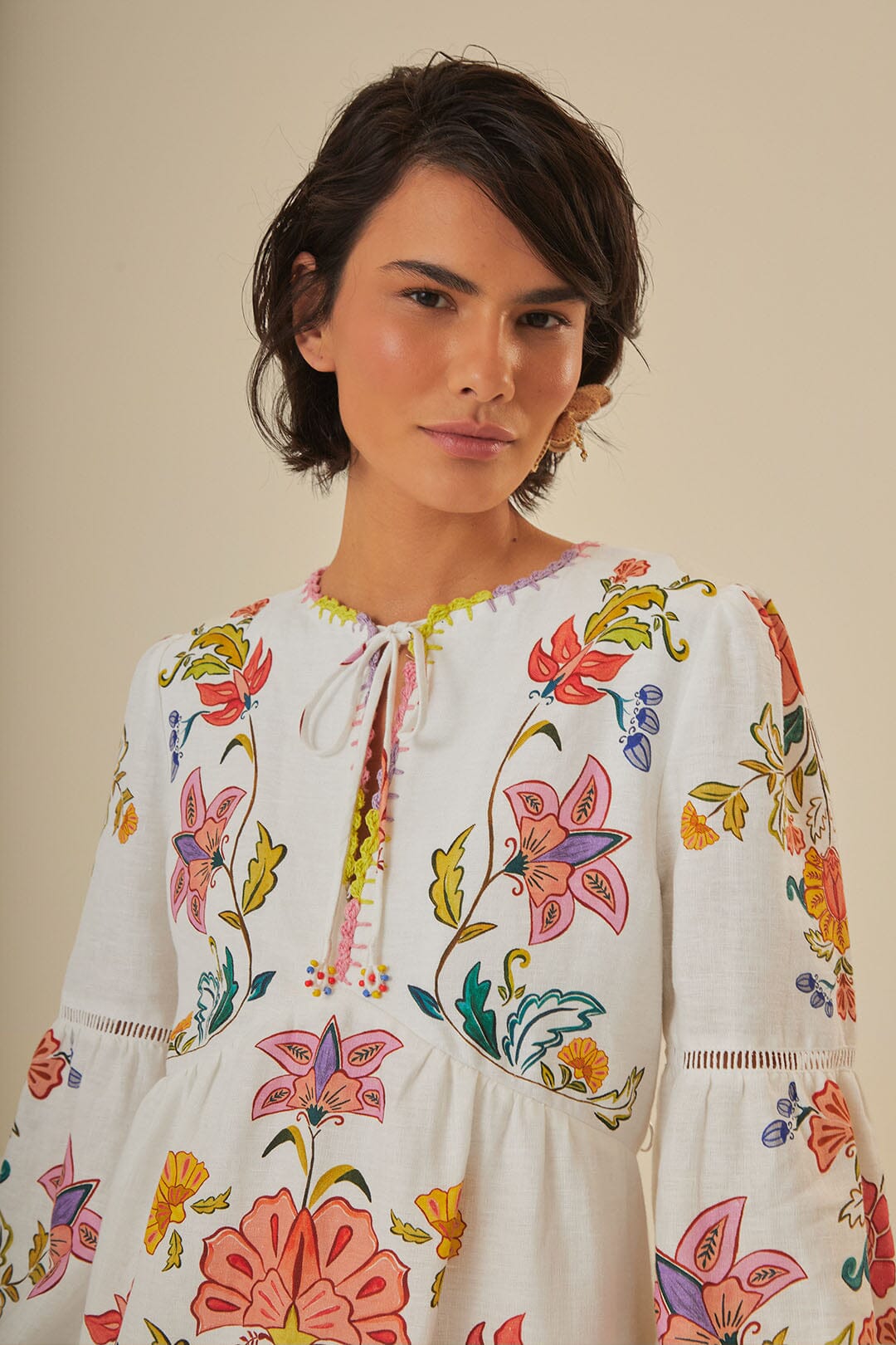 FARM Rio model wearing the Floral Insects Off White Mini Dress