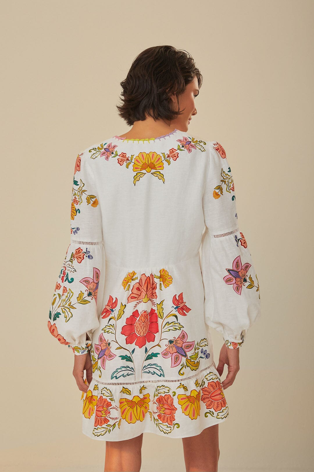 FARM Rio model wearing the Floral Insects Off White Mini Dress