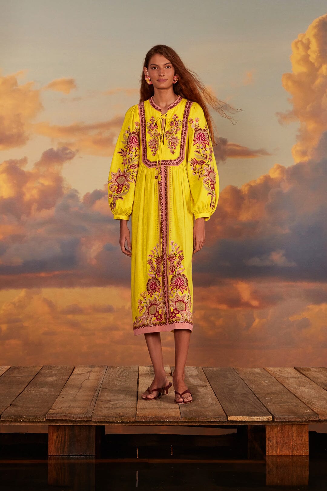 FARM Rio model wearing the Yellow Embroidered Garden Tapestry Midi Dress