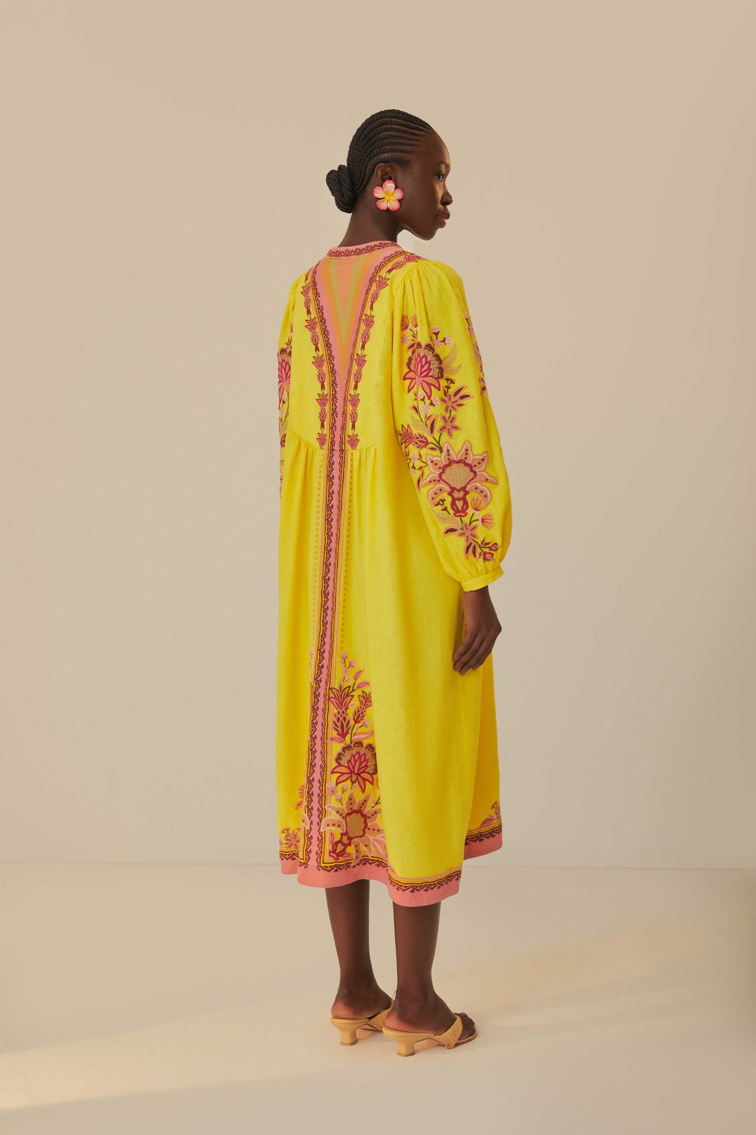FARM Rio model wearing the Yellow Embroidered Garden Tapestry Midi Dress