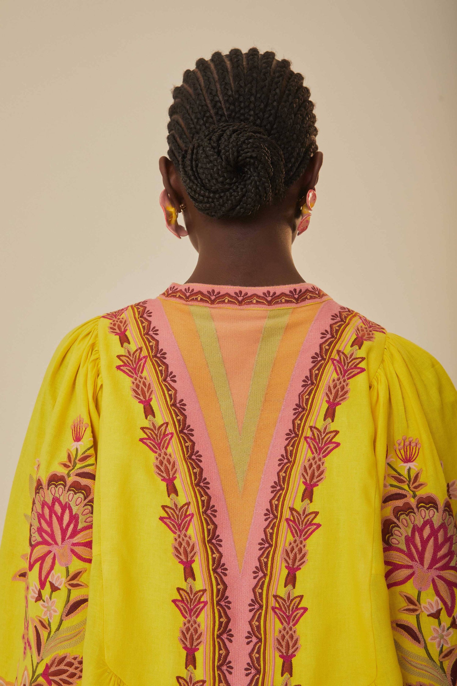 FARM Rio model wearing the Yellow Embroidered Garden Tapestry Midi Dress