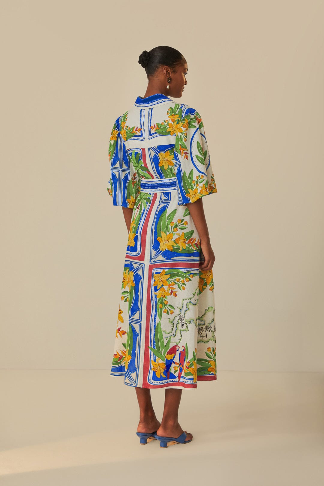 FARM Rio model wearing the Tropical Destination Off-White Midi Dress