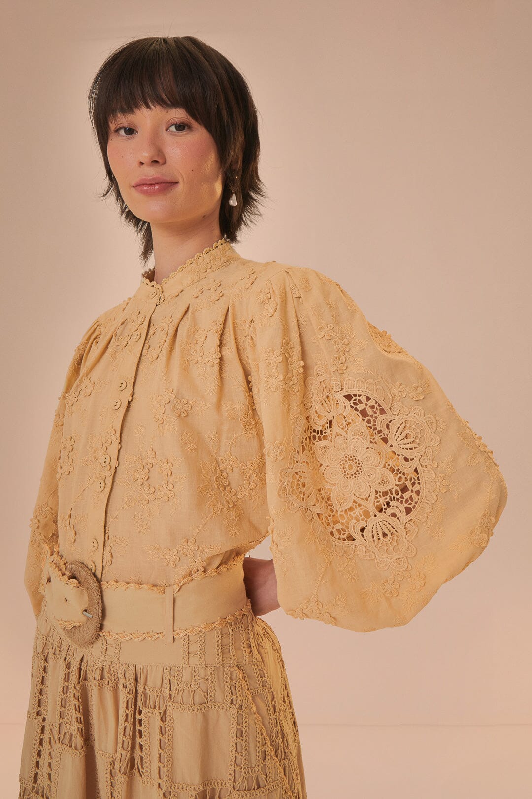 FARM Rio model wearing the Sand 3D Flower Blouse