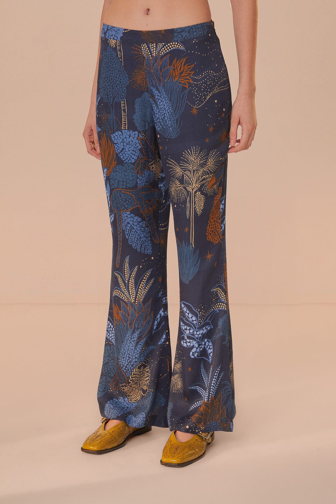 FARM Rio model wearing the Night Jungle Navy Blue Flare Pants