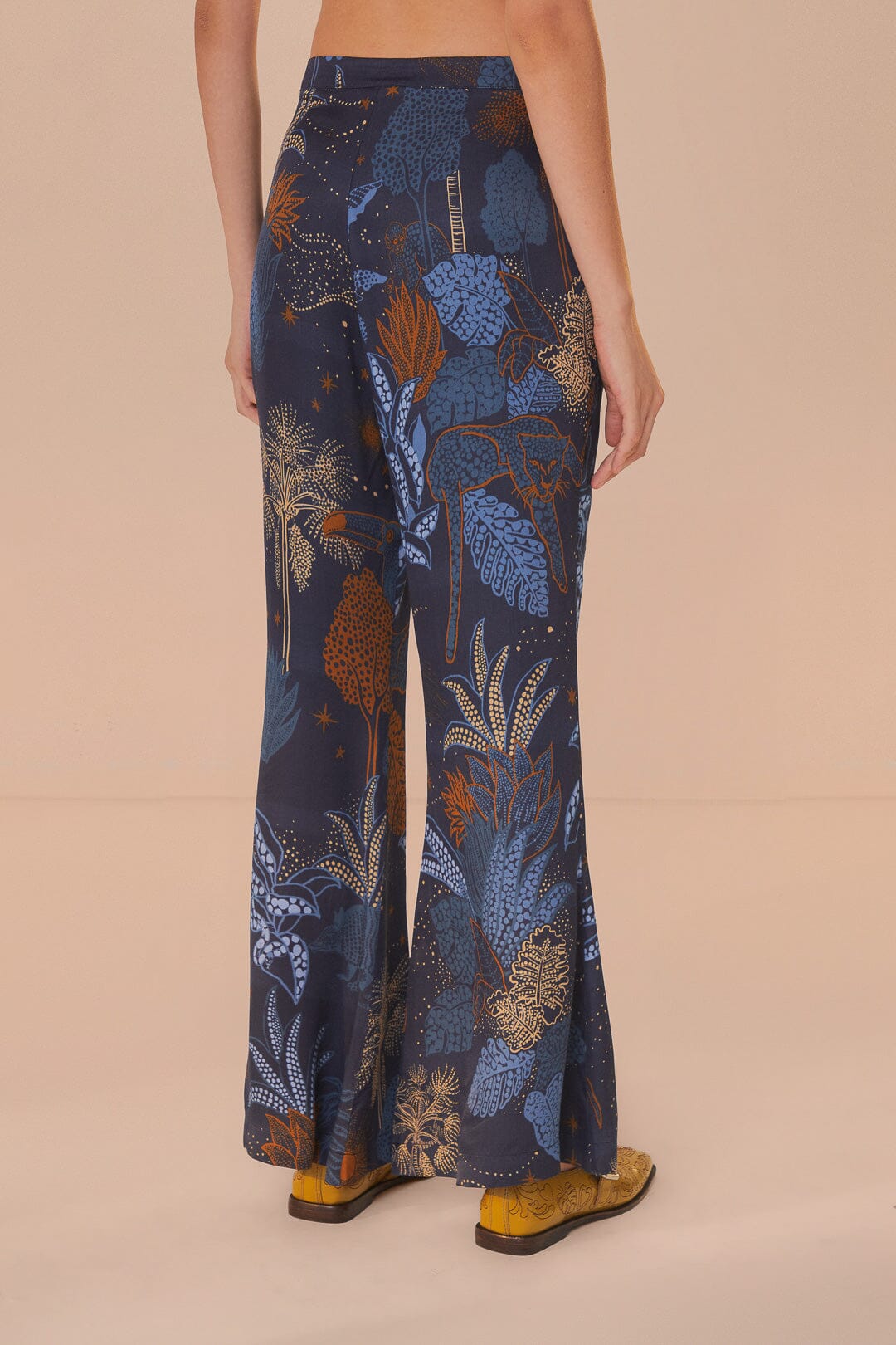 FARM Rio model wearing the Night Jungle Navy Blue Flare Pants