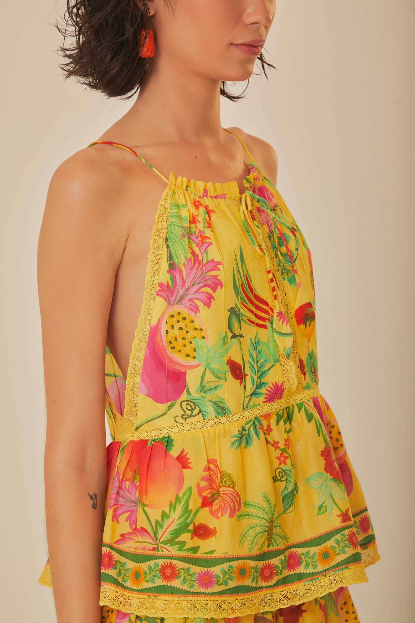 FARM Rio model wearing the Delicate Fruit Garden Yellow Sleeveless Blouse