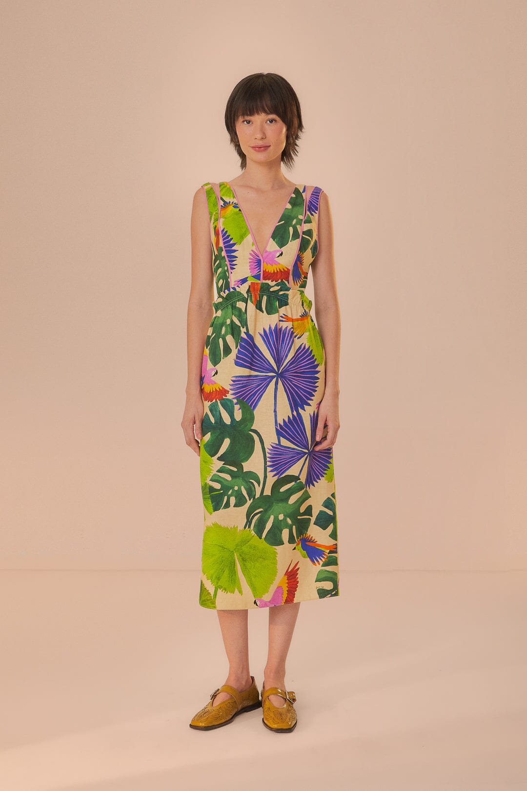 FARM Rio model wearing the Macaw Jungle Sand V Neckline Midi Dress
