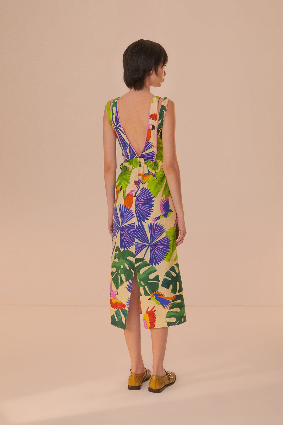 FARM Rio model wearing the Macaw Jungle Sand V Neckline Midi Dress