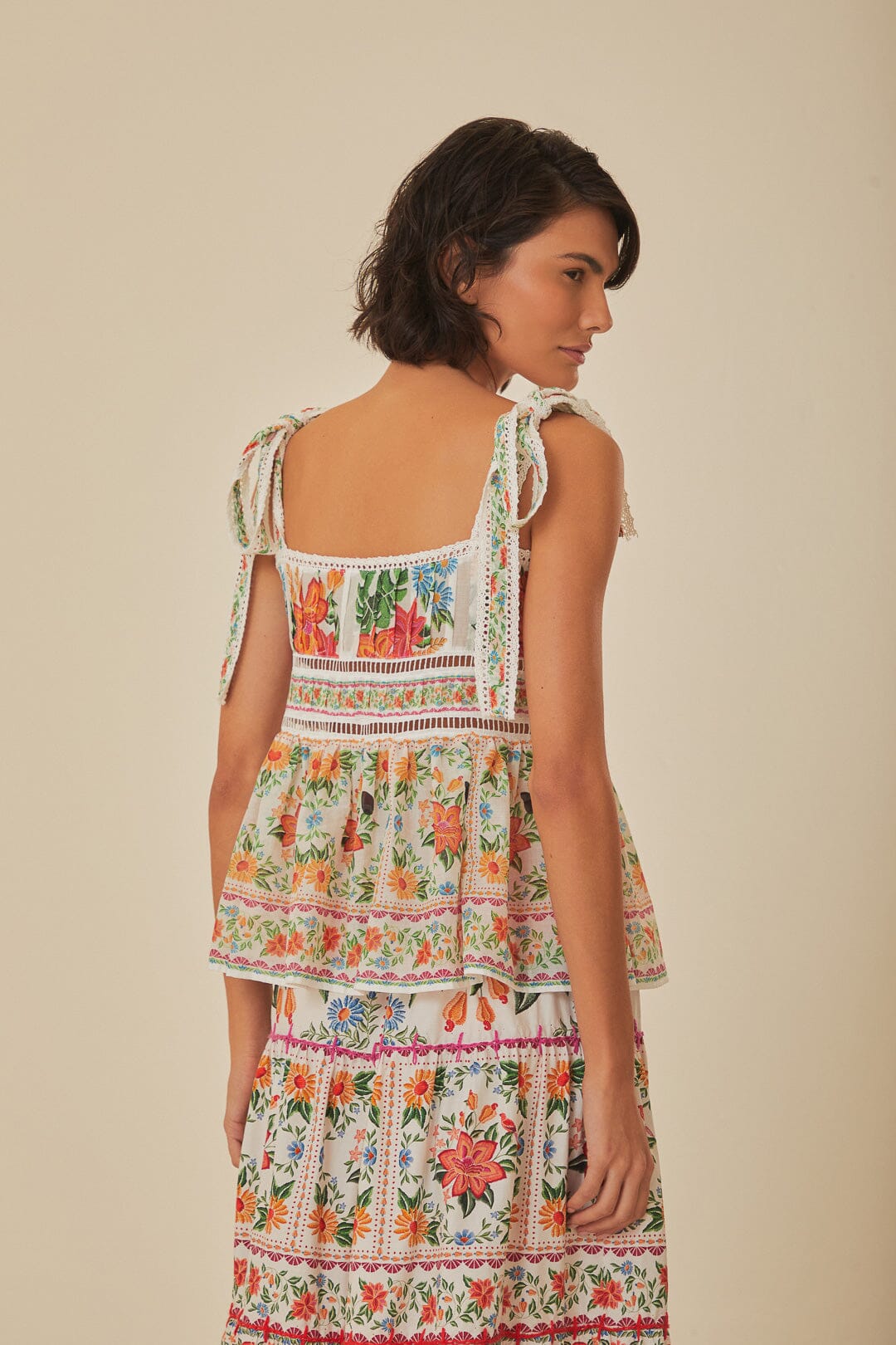 FARM Rio model wearing the Off White Bloom Garden Sleeveless Blouse