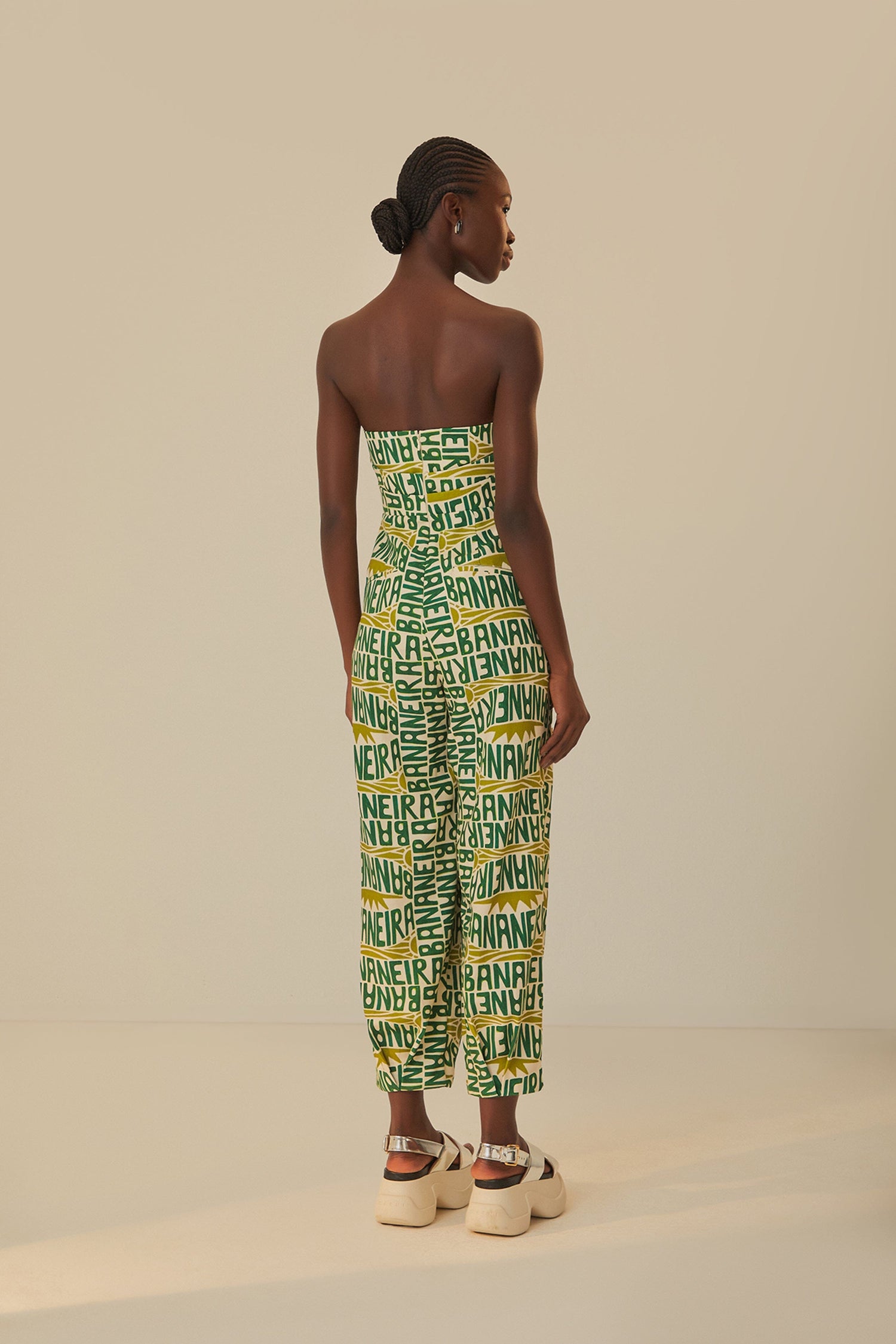 FARM Rio model wearing the Banana Typography Strapless Maxi Jumpsuit