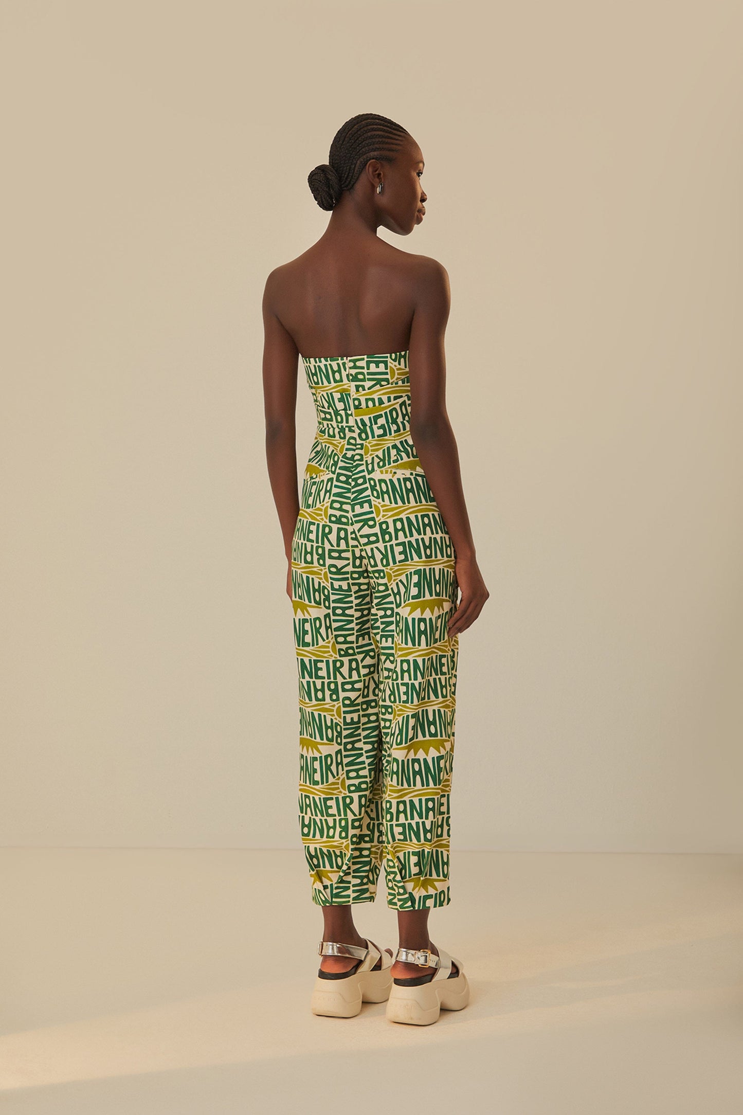 FARM Rio model wearing the Banana Typography Strapless Maxi Jumpsuit