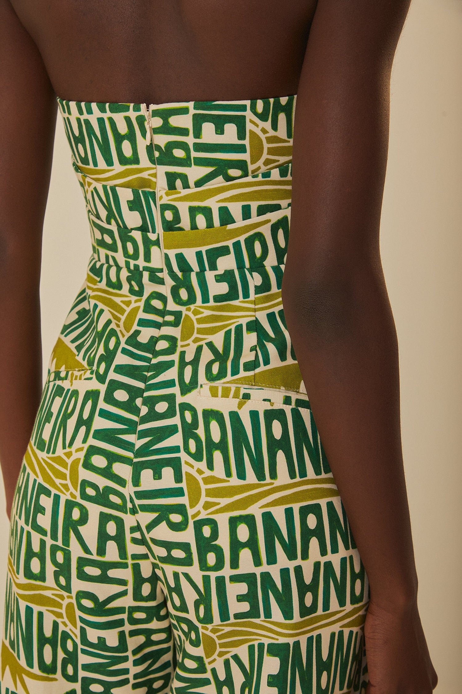 FARM Rio model wearing the Banana Typography Strapless Maxi Jumpsuit