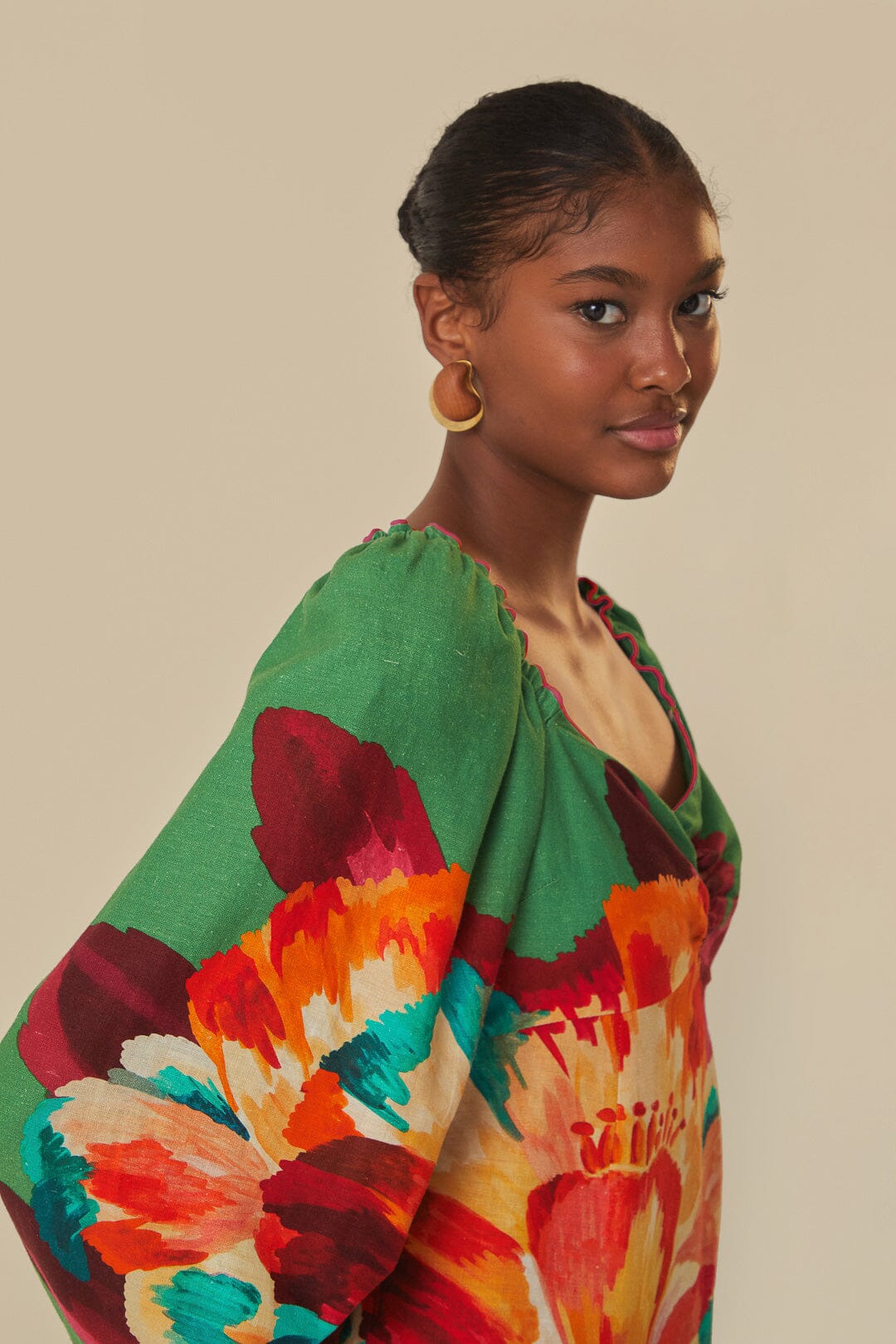 FARM Rio model wearing the Tropicart Green Mini Dress