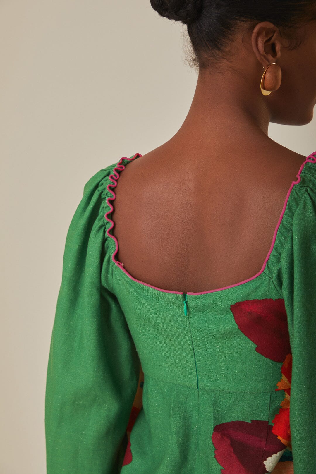 FARM Rio model wearing the Tropicart Green Mini Dress