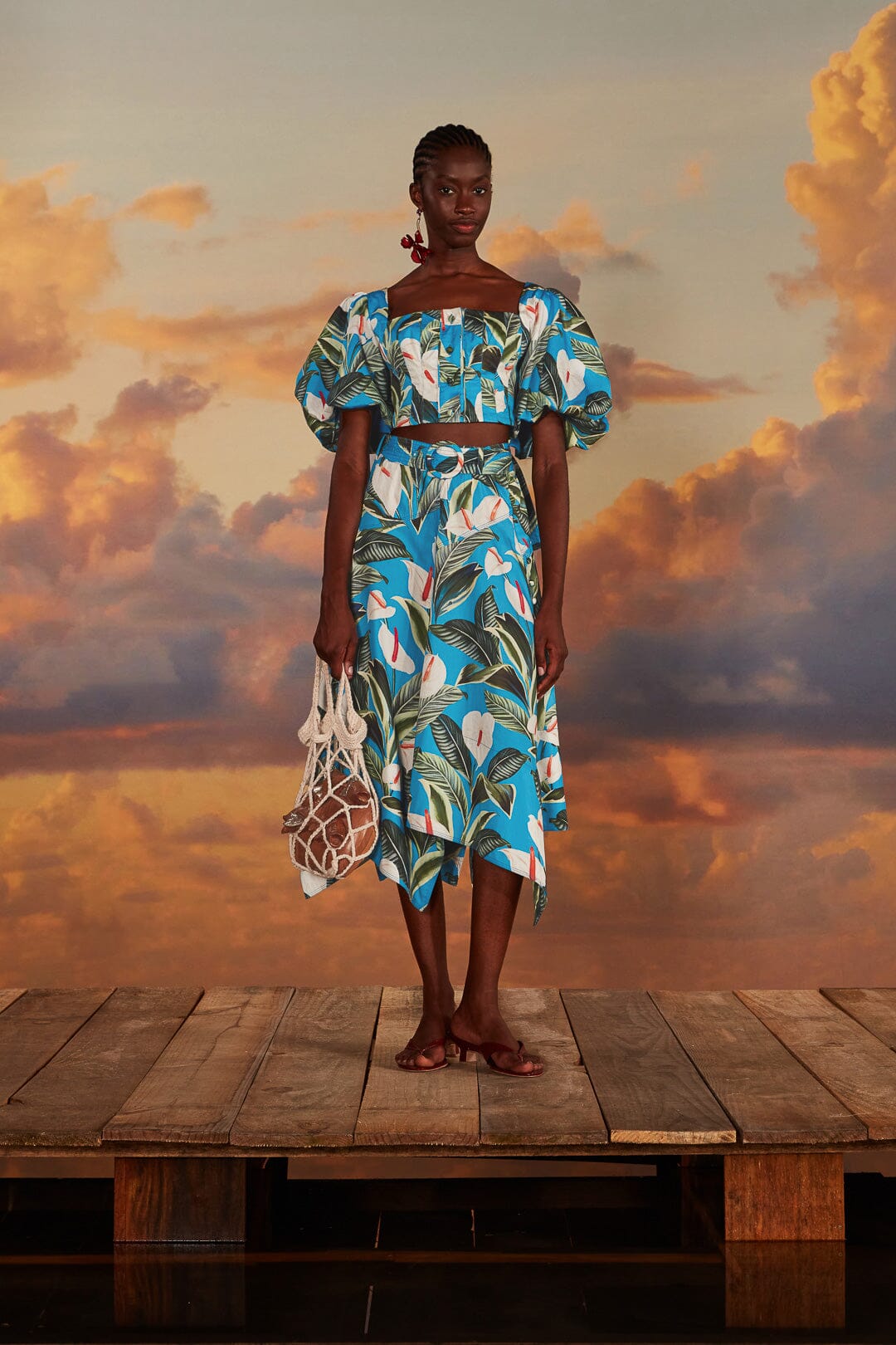 FARM Rio model wearing the Anthurium Garden Blue Asymmetric Midi Skirt