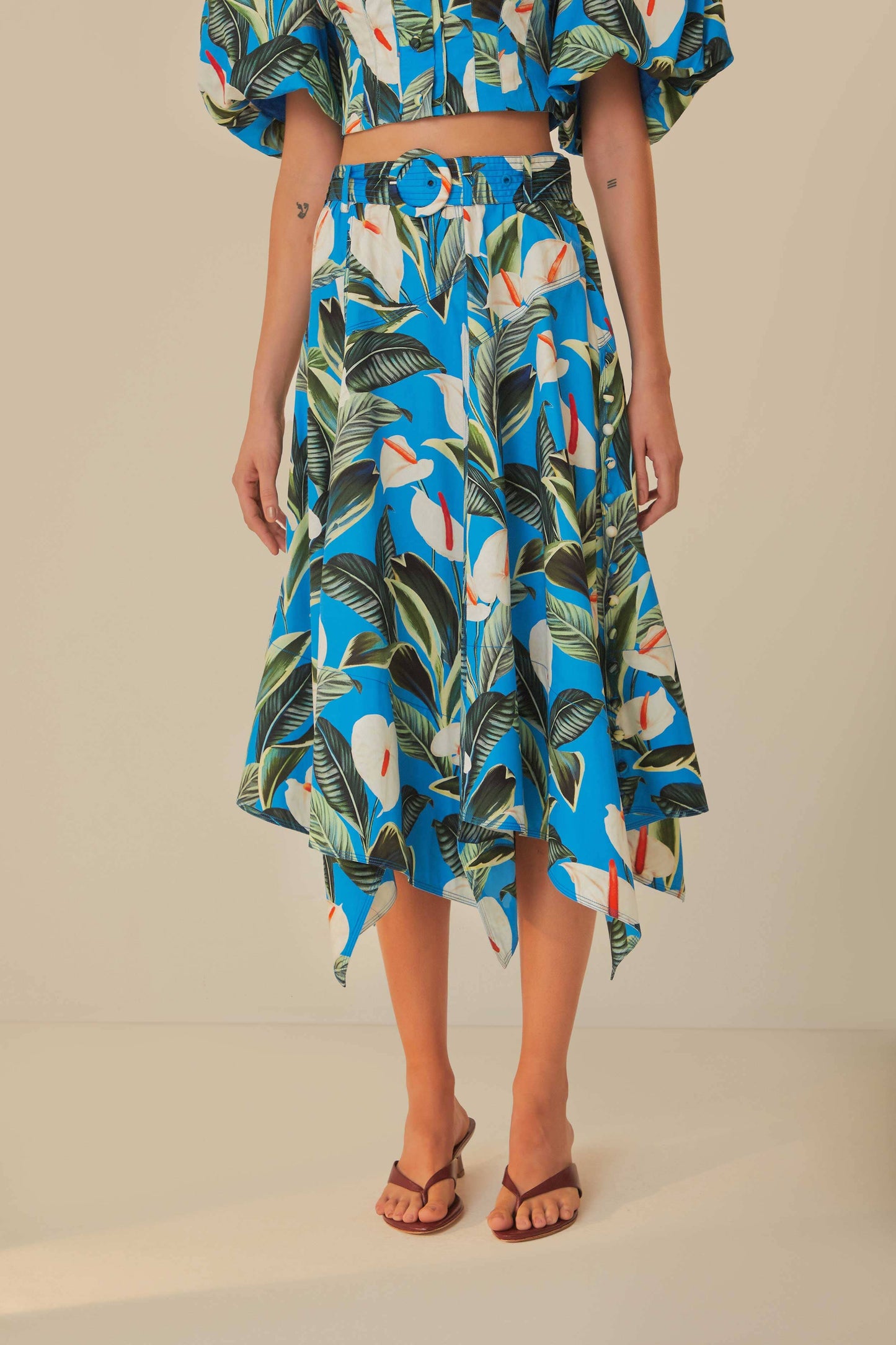 FARM Rio model wearing the Anthurium Garden Blue Asymmetric Midi Skirt
