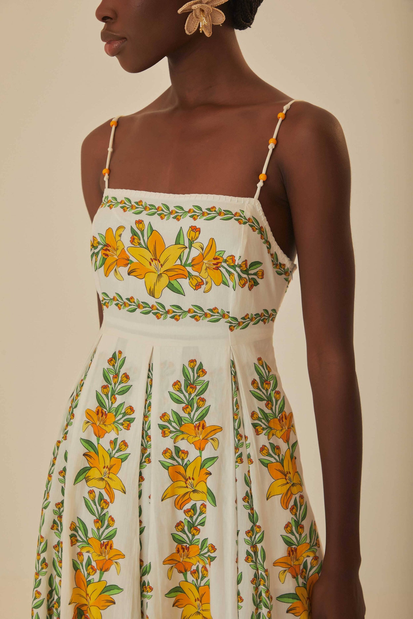 FARM Rio model wearing the Tropical Lightness Off-White Sleeveless Maxi Dress