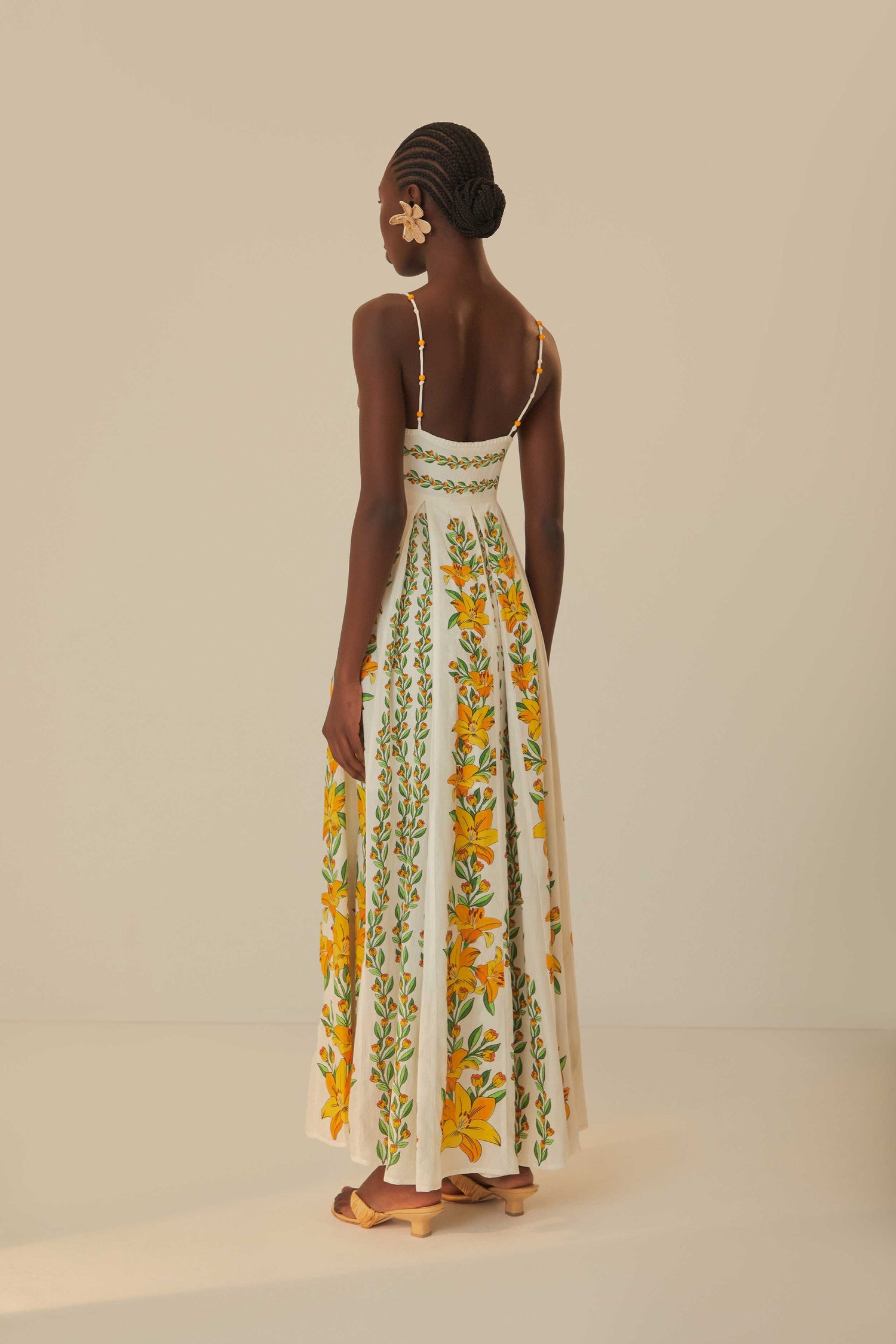 FARM Rio model wearing the Tropical Lightness Off-White Sleeveless Maxi Dress