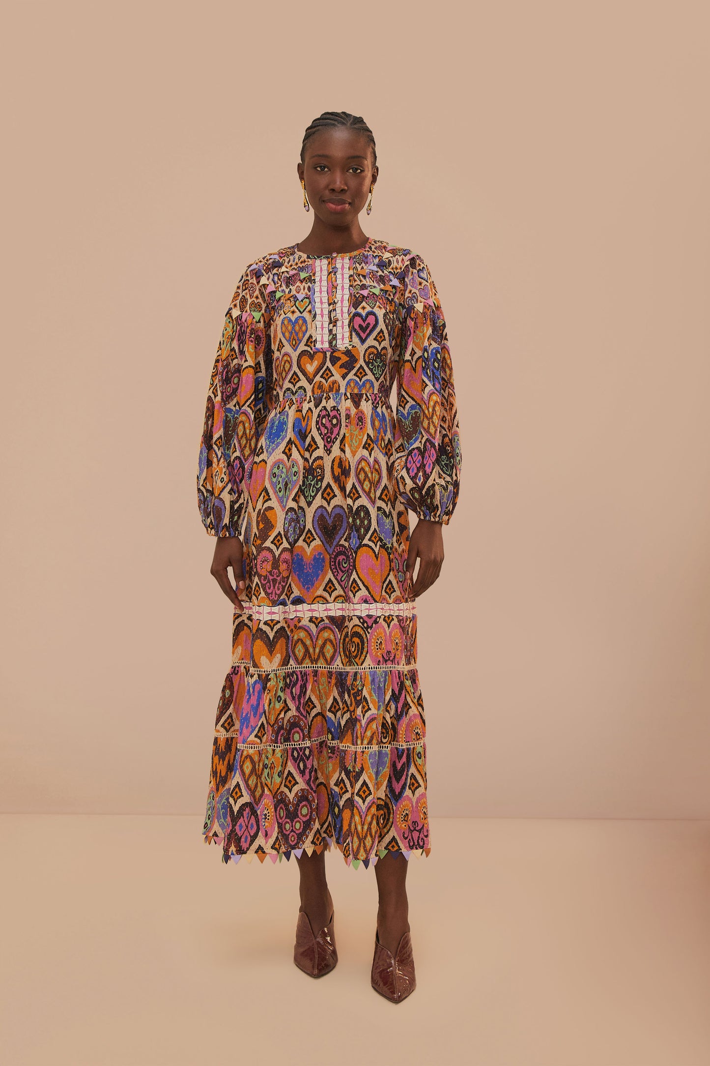 FARM Rio model wearing the Hearts Ikat Cream Long Sleeve Maxi Dress