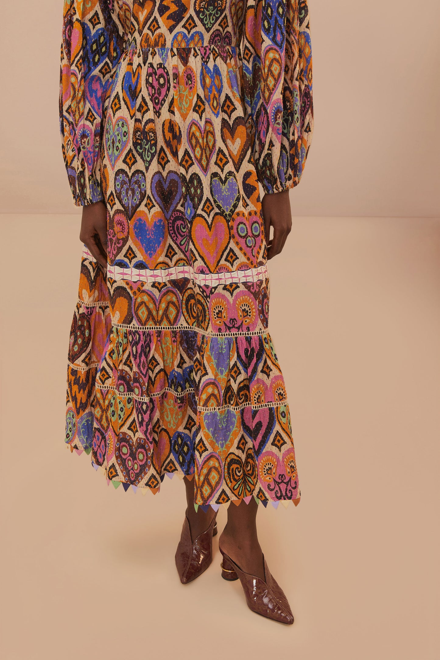 FARM Rio model wearing the Hearts Ikat Cream Long Sleeve Maxi Dress