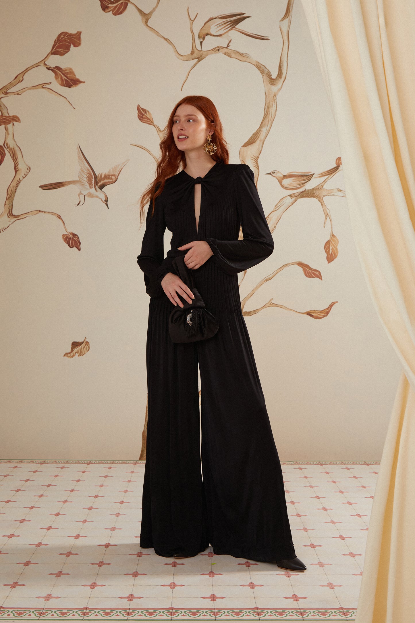 FARM Rio model wearing the Black Long Sleeve Knot Jumpsuit