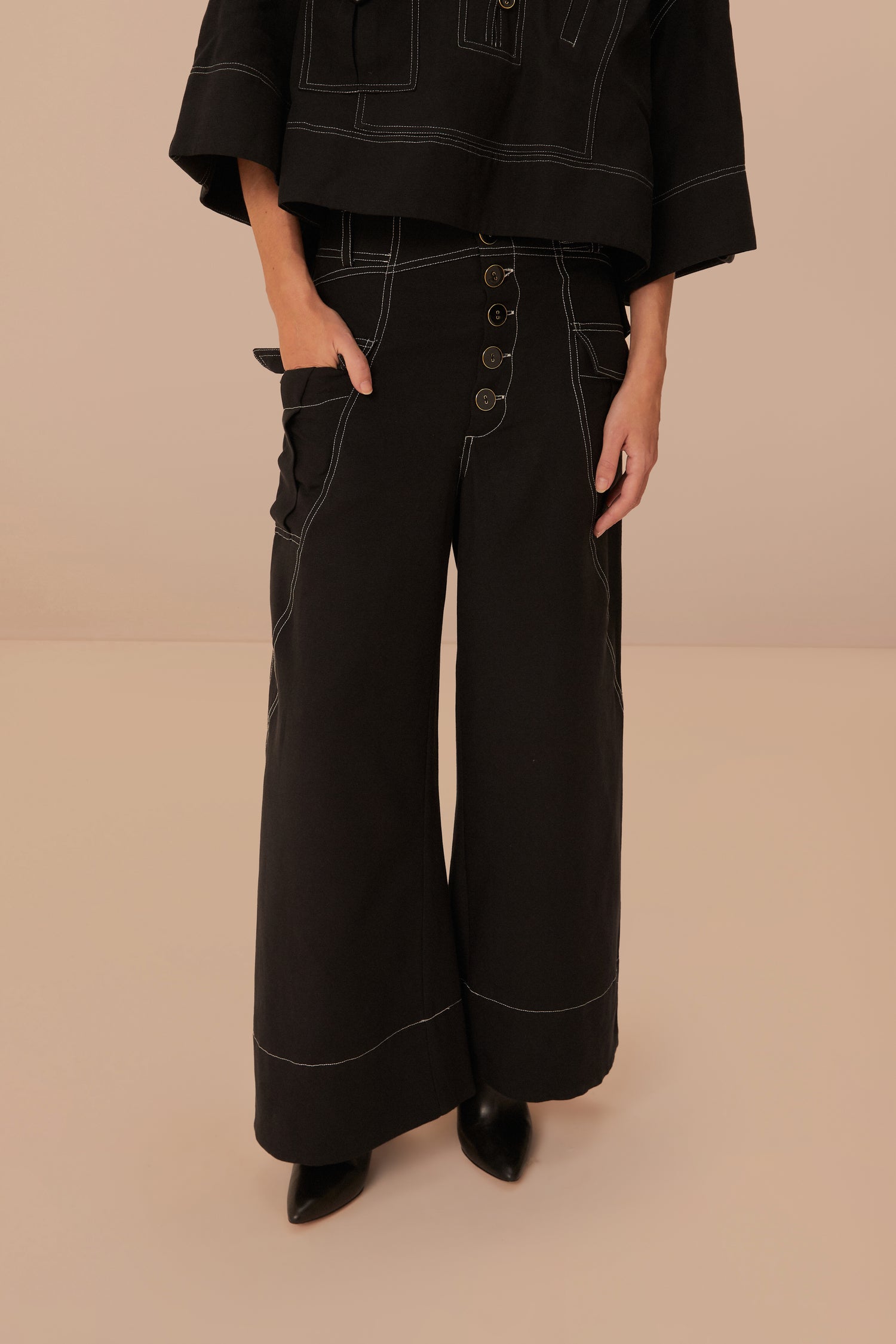 FARM Rio model wearing the Black Low Waisted Topstiched Pants