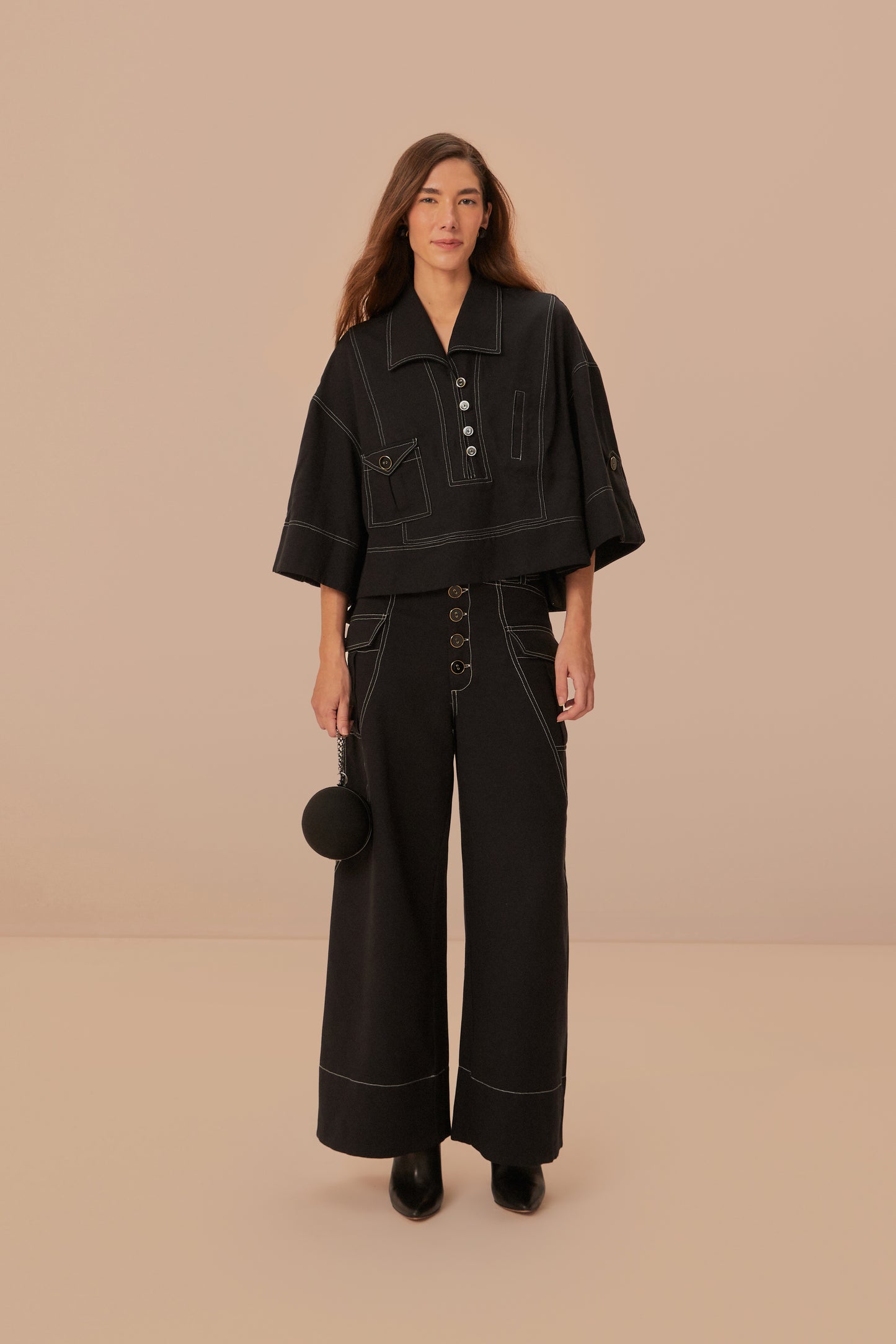 FARM Rio model wearing the Black Low Waisted Topstiched Pants
