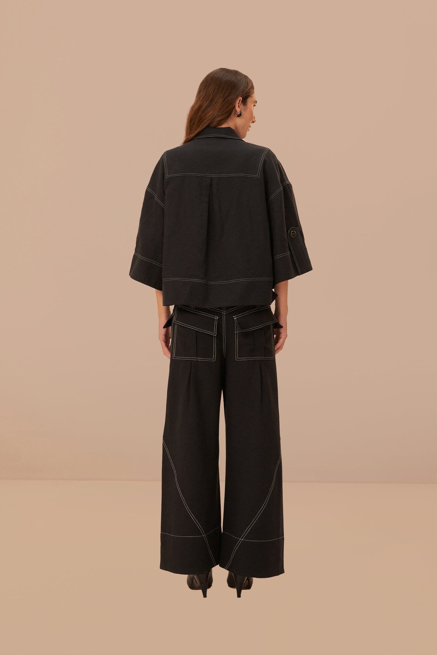 FARM Rio model wearing the Black Low Waisted Topstiched Pants