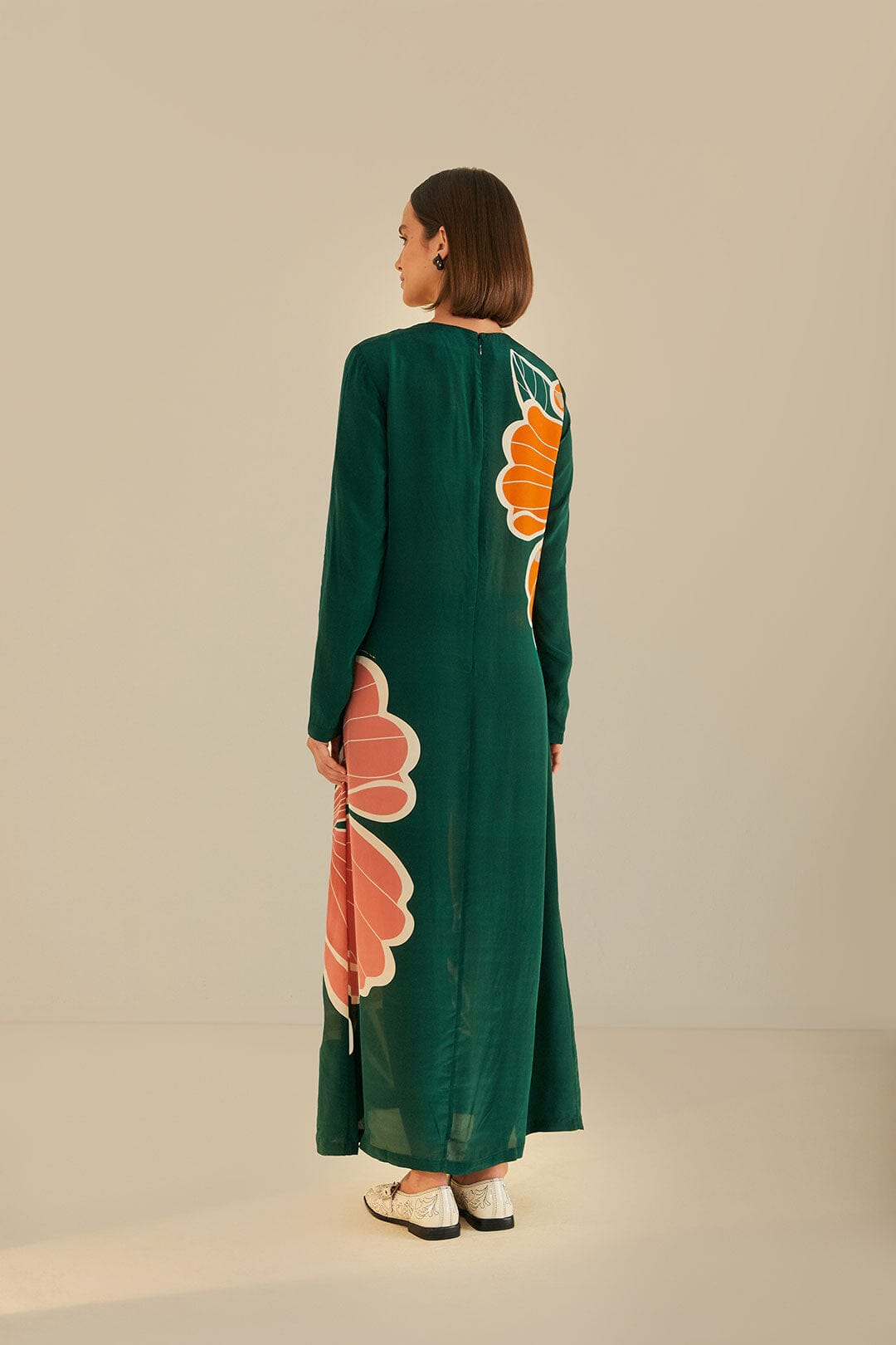 FARM Rio model wearing the Honolulu Flowers Green Long Sleeve Maxi Dress