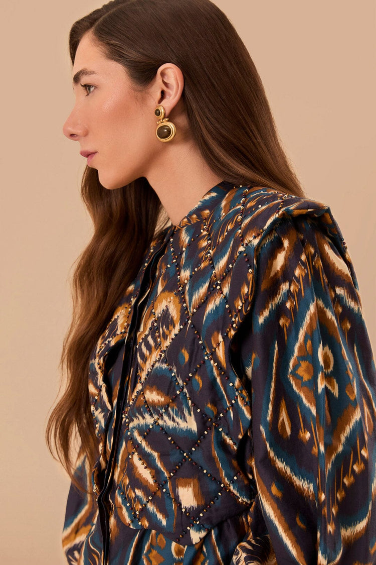 FARM Rio model wearing the Pineapple Ikat Blue Long Sleeve Matelasse Blouse