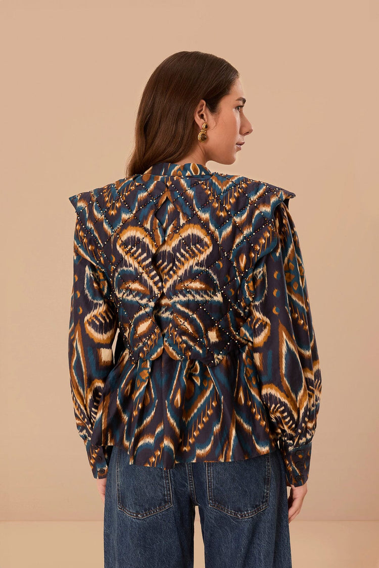FARM Rio model wearing the Pineapple Ikat Blue Long Sleeve Matelasse Blouse